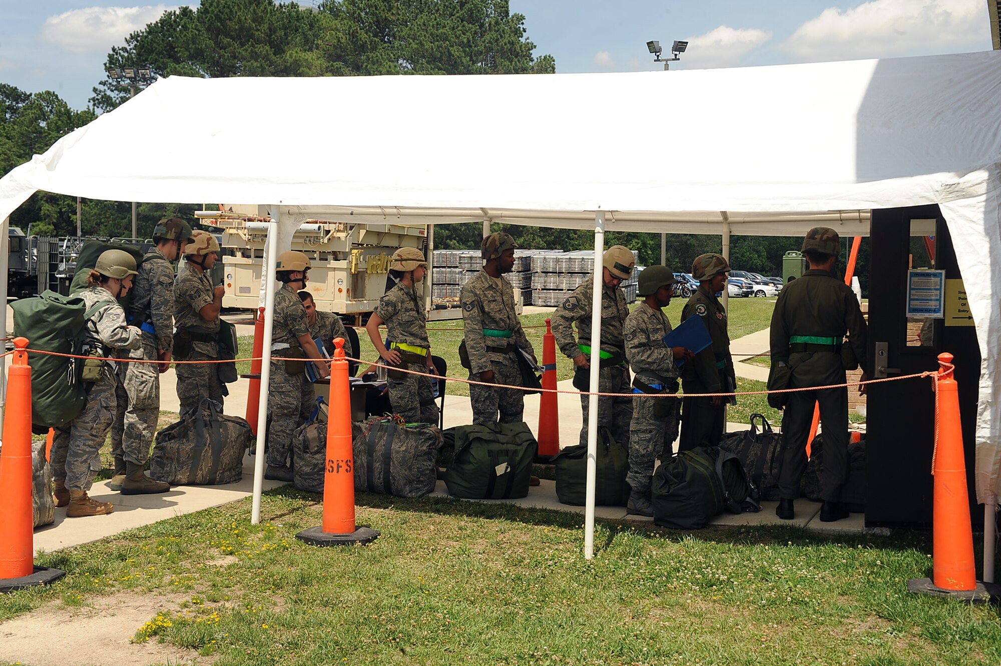 SEYMOUR JOHNSON AIR FORCE BASE, N.C. -- Airmen wait in the Personnel Deployment Function processing line during a Phase I Operational Readiness Exercise June 8, 2010. During the exercise, Airmen and units prepared items for deployment such as mobility bags, hazardous materials, classified items, weapons and ammunition based on deployment taskings which are not always part of a standard air expeditionary force deployment. (U.S. Air Force photo/Senior Airman Ciara Wymbs) 
