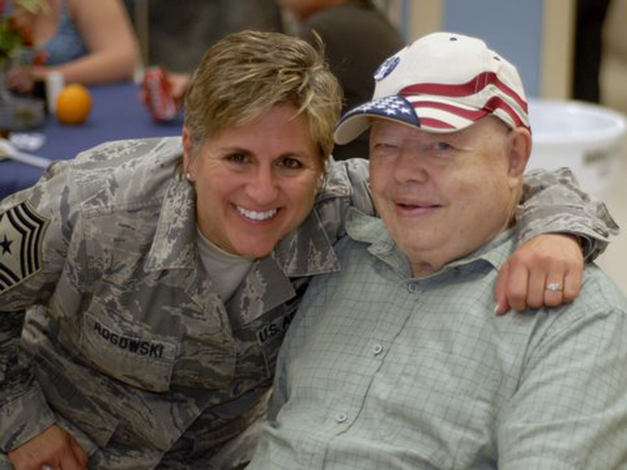 WRIGHT-PATTERSON AIR FORCE BASE, Ohio – Chief Master Sgt. Peri Rogowski, 445th Airlift Wing command chief, visits with a resident during the annual VA picnic June 5 at the Veterans Affairs Medical Center in Dayton, Ohio.  Reservists from the 445th Airlift Wing support the event every year, working with the Air Force Sergeants Association Kittyhawk Chapter 751 and the Air Force Association to support the VA residents.  (U.S. Air Force photo/Master Sgt. Charlie Miller)