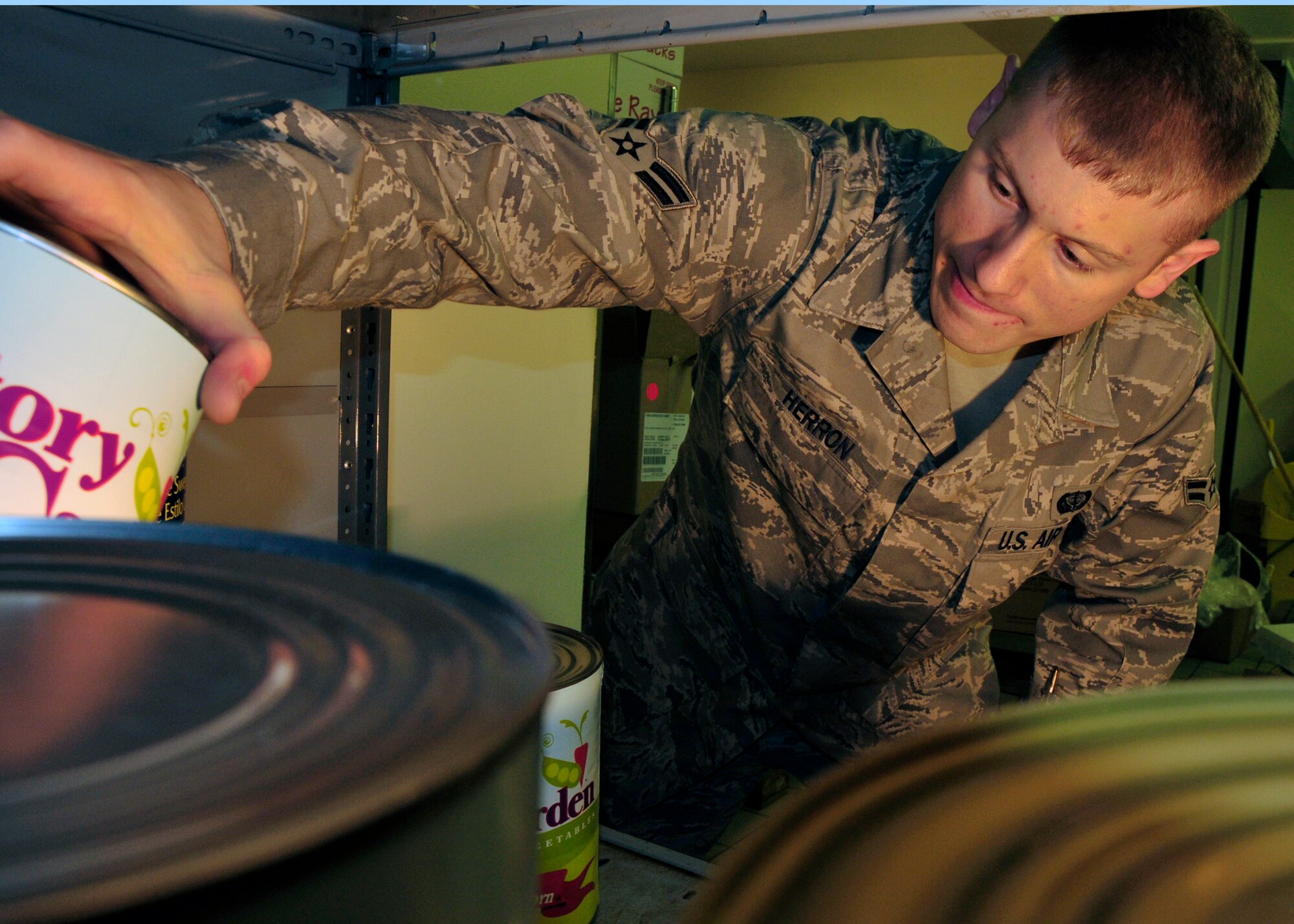 Airman 1st Class Casey Herron, 48th Force Support Squadron food service apprentice, stocks the food storage room at the Knight's Table dining facility at RAF Lakenheath, England June 7. Airman Herron was nominated for the liberty spotlight because he displays the core value 'Service Before Self'. (U.S. Air Force photo/Airman 1st Class Eboni Knox)