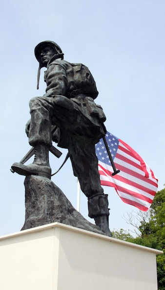 NORMANDY, France – A monument at the famous “Iron Mike” drop zone near St. Mere Eglise, used by Allied paratroopers in the 1944 D-Day invasion, shows a U.S. servicemember from World War II.  The memorial was the site of a ceremony where hundreds of paratroopers received wings from countries other than their own after participating in a static-line jump June 5. (U.S. Air Force photo/ Staff Sgt. Brad Keszler)