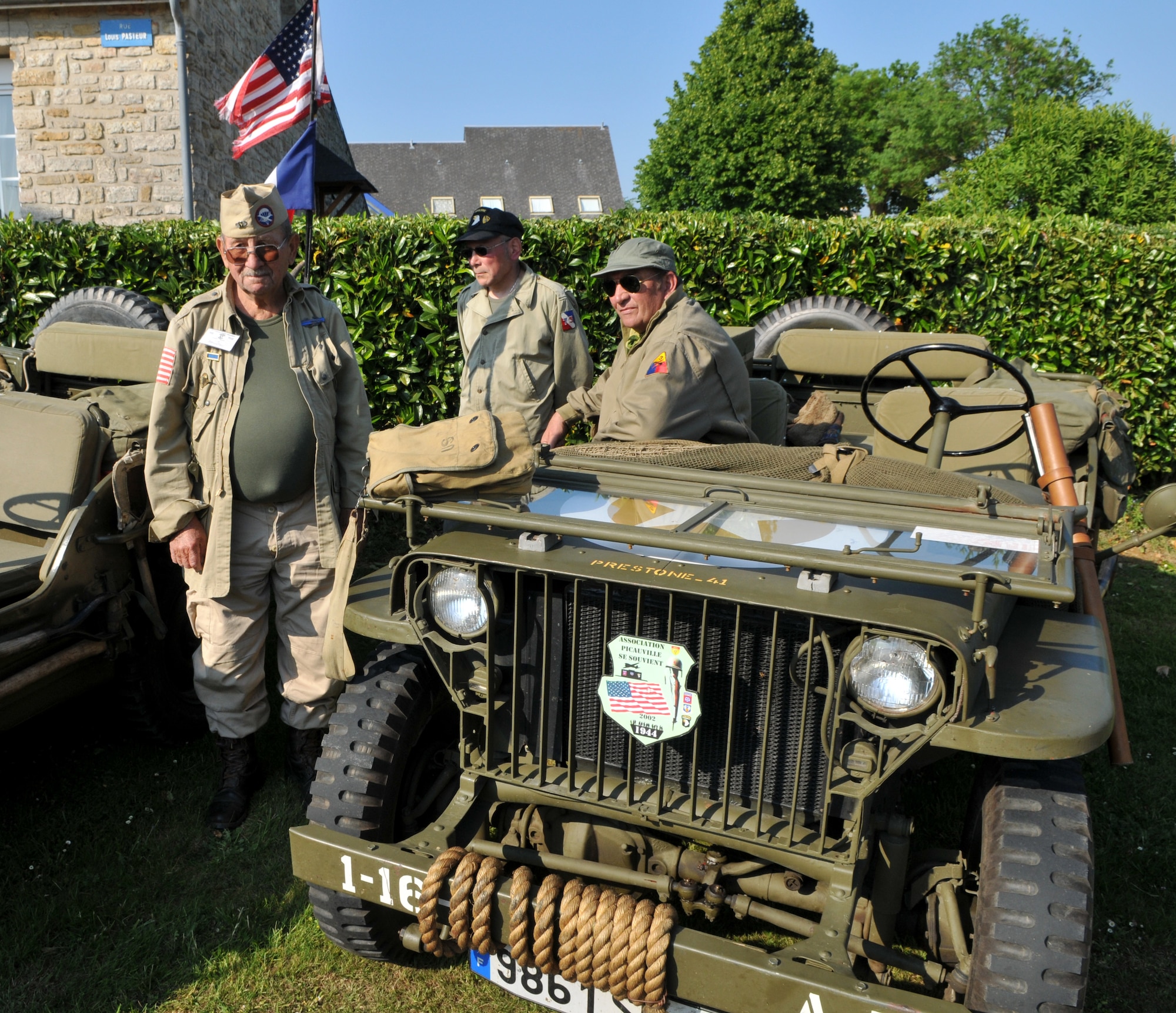 NORMANDY, France – French World War II re-enactors watch a small ceremony in Picauville, one of the first towns liberated by the Allies in the D-Day invasion in 1944.  Hundreds of American and British servicemembers participated in the ceremony June 3. (U.S. Air Force photo/Staff Sgt. Austin M. May)