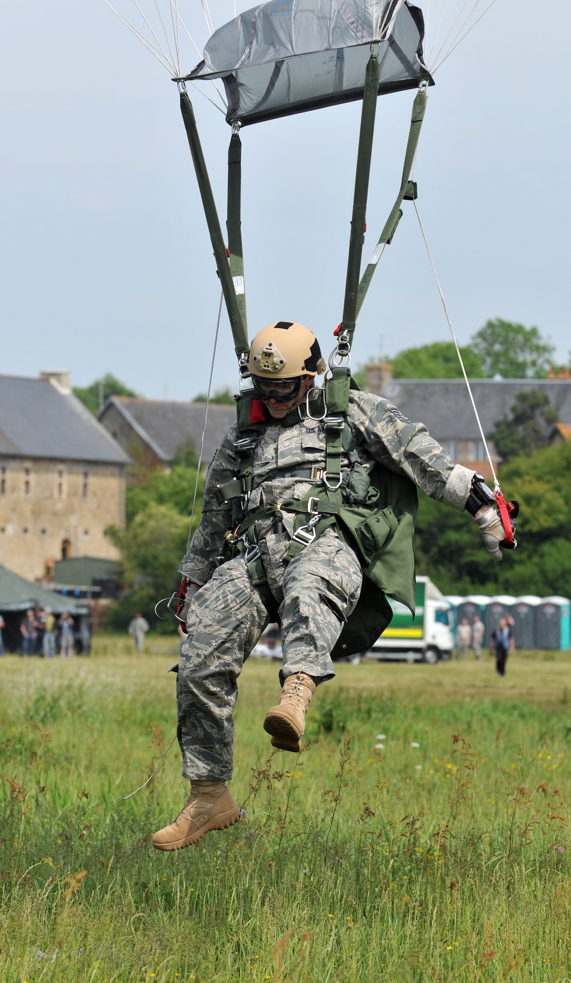 NORMANDY, France – A member of the 321st Special Tactics Squadron, RAF Mildenhall, England, lands in the “Iron Mike” drop zone, where the Allies first landed in the D-Day invasion of World War II, June 5.  The High Altitude, Low Opening jump was part of a ceremony commemorating the 66th anniversary of D-Day.  (U.S. Air Force photo/Staff Sgt. Austin M. May)