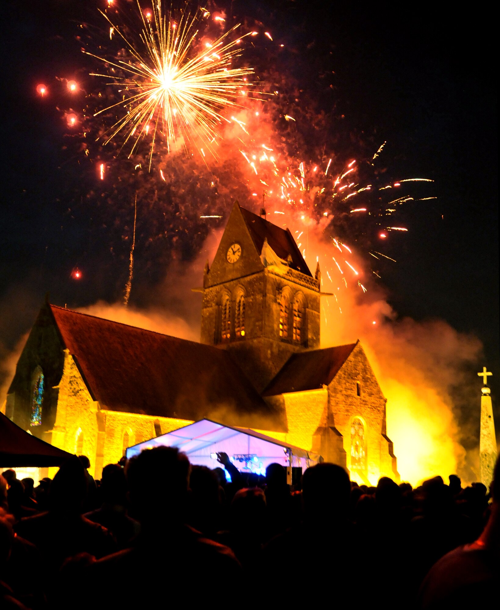 NORMANDY, France – Fireworks burst over the church in St. Mere Eglise during a celebration commemorating the 66th anniversary of the D-Day landings in World War II.  French, British, German and American servicemembers, including a team from the 321st Special Tactics Squadron, RAF Mildenhall, England, who participated in a memorial parachute drop June 5.  (U.S. Air Force photo/Staff Sgt. Austin M. May)