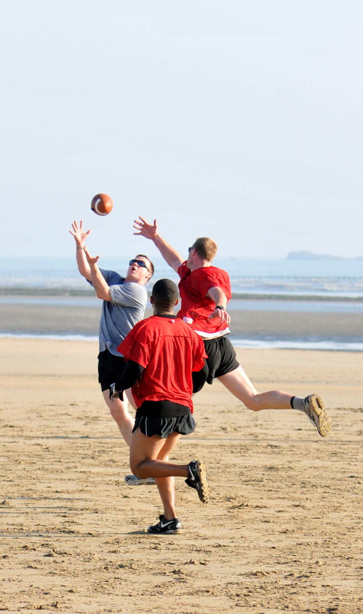 NORMANDY, France – Members of the 321st Special Tactics Squadron, RAF Mildenhall, England, play ultimate football on Utah Beach, one of the sites of the Allied landing in Europe in World War II, June 4.  The Airmen were in Normandy to participate in several ceremonies commemorating the 66th anniversary of the D-Day landings.  (U.S. Air Force photo/Staff Sgt. Austin M. May)