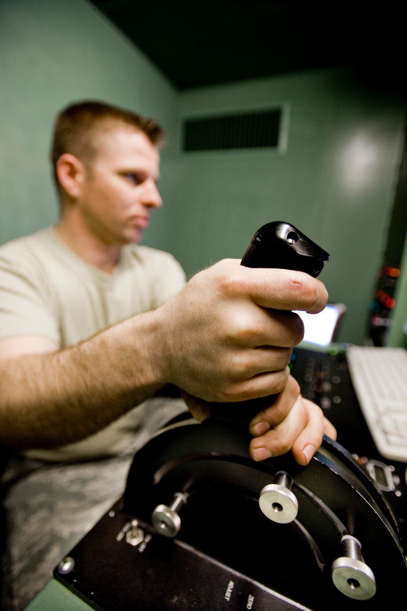 MISAWA AIR BASE, Japan -- Staff Sgt. Danny Shaw, 35th Maintenance Squadron test-cell technician, increases engine thrust from within the safety of the engine-run cab during an engine operational check May 3 at the Hush House. From the engine-run cab, test-cell personnel can control and monitor jet engines during test operations. (U.S. Air Force photo/Senior Airman Jamal D. Sutter)
