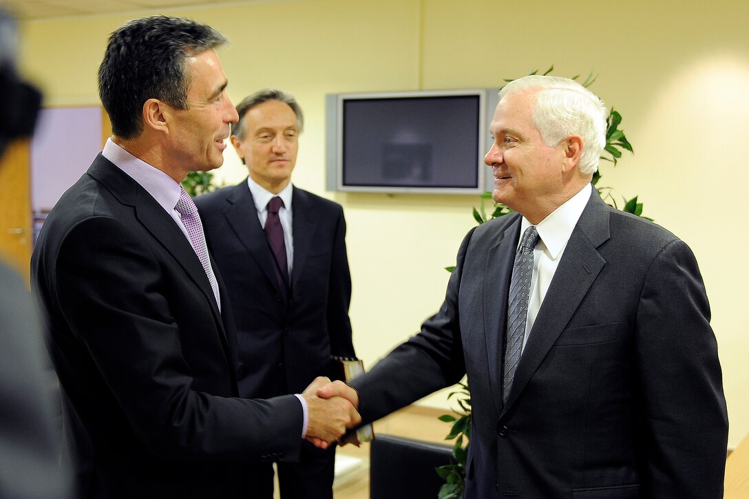 Anders Fogh Rasmussen, NATO's secretary general, left, welcomes U.S. Defense Secretary Robert M. Gates to NATO Headquarters in Brussels, Belgium as part of a NATO Defense Ministerial, June 9, 2010.