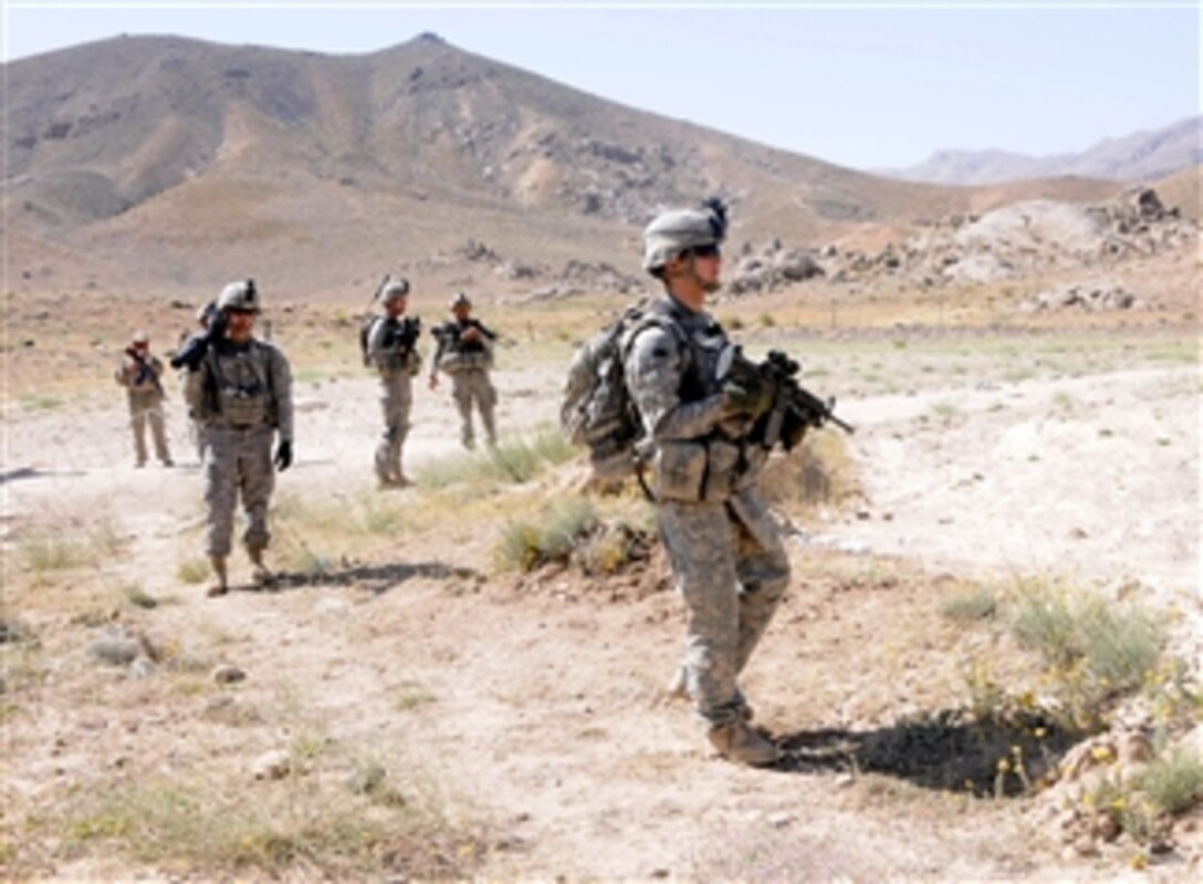 U.S. Army Pvt. Matthew Bean (right) and other U.S. soldiers, all of Red Tank, 1st Platoon, Delta Company, 1st Battalion 4th Infantry Regiment, patrol to Lamar, in Zabul province, Afghanistan, on June 8, 2010.  