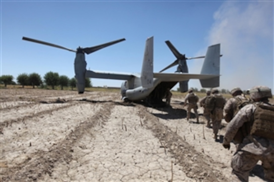 U.S. Marines board a V-22 Osprey aircraft at Control Base Karma in the Helmand province of Afghanistan on June 9, 2010.  U.S. Marine Corps Maj. Gen. Richard P. Mills, commanding general of I Marine Expeditionary Force (Forward) and Sgt. Maj. Michael Barrett, the unit’s sergeant major, were in the area visiting with Marines assigned to Weapons Company, 3rd Battalion, 1st Marine Regiment.  Mills assessed the battle conditions and the status of Marines directly involved in the fight against insurgency while in support of the International Security Assistance Force.  
