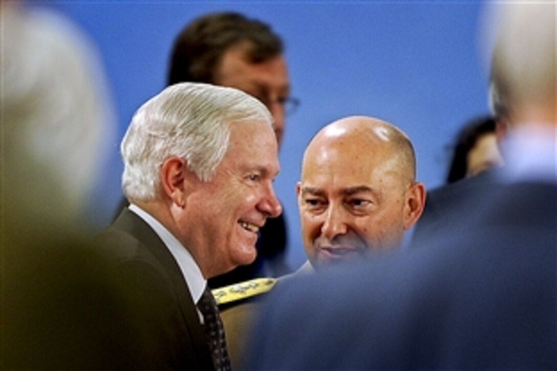 U.S. Defense Secretary Robert M. Gates talks to U.S. Navy Adm. James Stavridis, NATO's supreme allied commander for Europe, while attending the NATO Defense Ministerial in Brussels, Belgium, June 9, 2010.