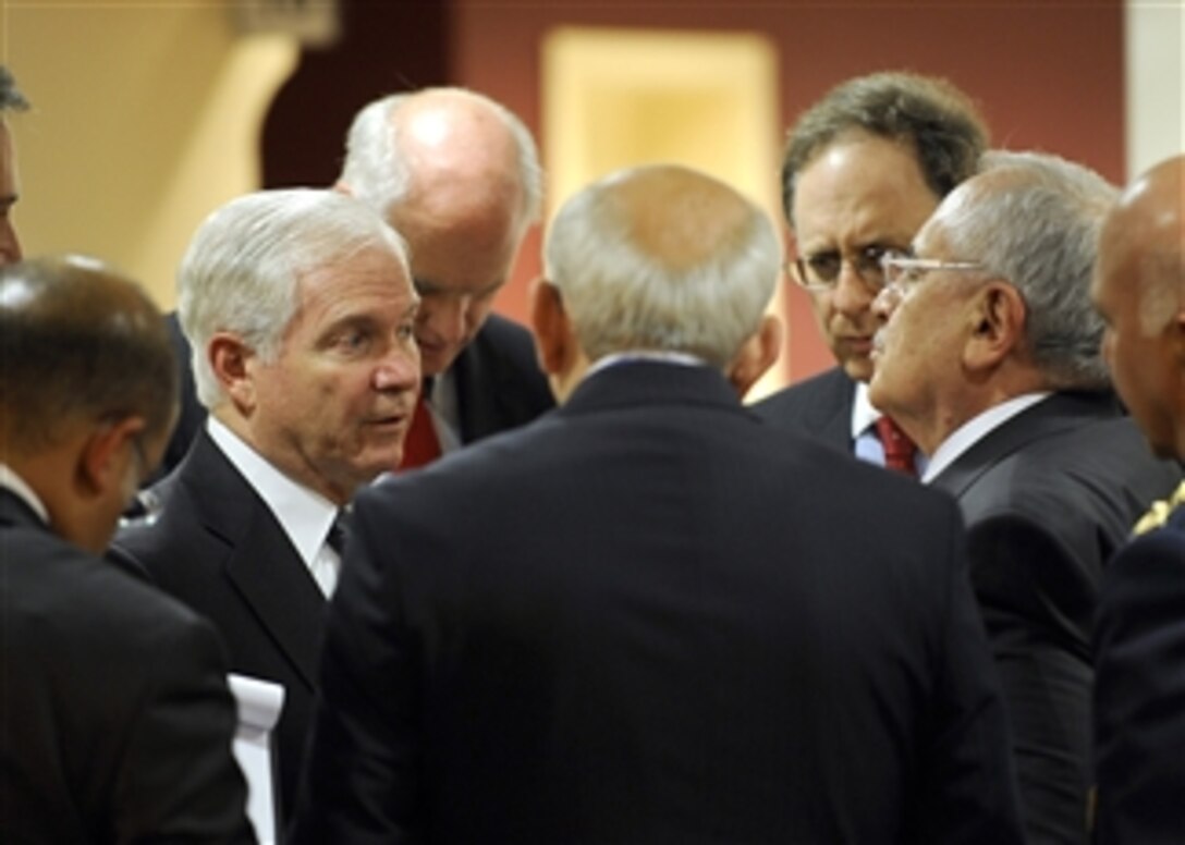 Secretary of Defense Robert M. Gates talks with Turkish Defense Minister Mehmet Vecdi Gonul at the North Atlantic Treaty Organization Defense Ministerial at NATO Headquarters in Brussels, Belgium, on June 9, 2010.  