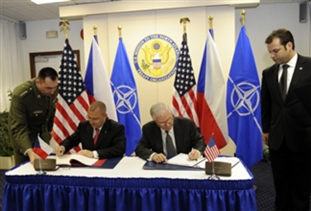 Czech Republic Defense Minister Martin Bartak and Secretary of Defense Robert M. Gates sign an agreement that paves the way for the two countries to work together in developing science and technology programs during the North Atlantic Treaty Organization Defense Ministerial at NATO Headquarters in Brussels, Belgium, on June 9, 2010.  