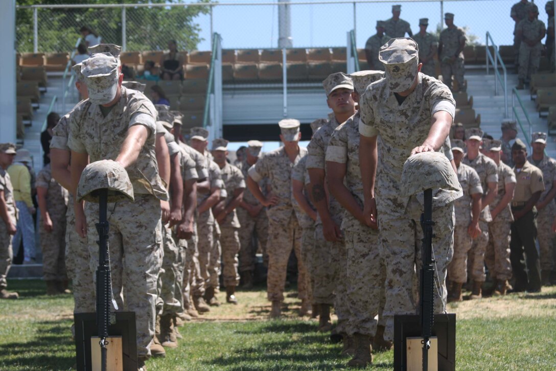 Marines line up to pay their respects to Lance Corporals Joshua Birchfield and Cody Stanley, both Marines from 3rd Battalion, 4th Marine Regiment, during a memorial ceremony at Lance Cpl. Torrey L. Gray Field June 11. Birchfield and Stanley gave their lives in Afghanistan. Stanley belonged to Weapons Company, and Birchfield belonged to Company K.