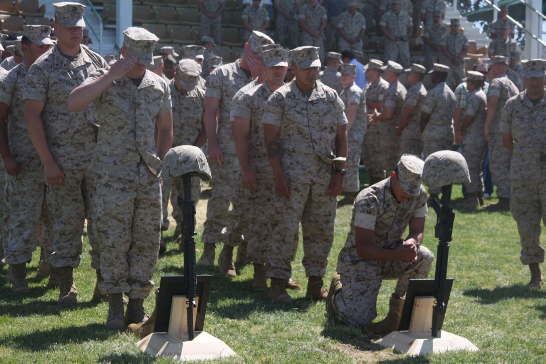 Marines line up to pay their respects to Lance Corporals Joshua Birchfield and Cody Stanley, both Marines from 3rd Battalion, 4th Marine Regiment, during a memorial ceremony at Lance Cpl. Torrey L. Gray Field June 11. Birchfield and Stanley gave their lives in Afghanistan. Stanley belonged to Weapons Company, and Birchfield belonged to Company K.
