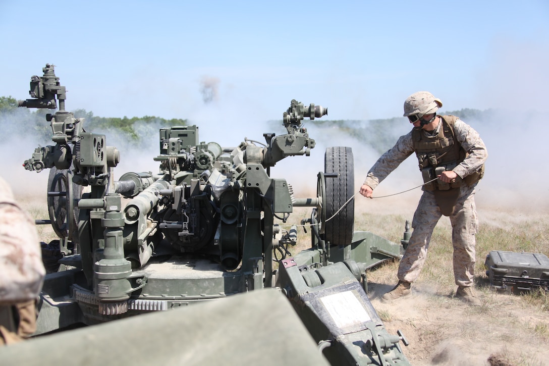 Artillerymen with Fox 2/12 Battery, Battalion Landing Team 3/8, 26th Marine Expeditionary Unit, pulls the lanyard to fire an M777 A2 Howitzer during a direct-fire exercise as part of Realistic Urban Training aboard Fort A.P. Hill, Va., June 11, 2010. During  the 18-day training evolution, the MEU will conduct several urban and other unit training exercises as part of its pre-deployment training. 26th MEU is scheduled to deploy later this fall.