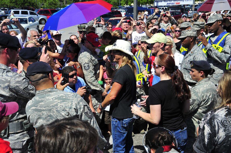 Bret Michaels speaks to the crowd of Hurlburt Field Airmen and their families to thank them for their service at the base exchange parking lot during his visit to Hurlburt Field, Fla., June 11, 2010.  (DoD photo by U. S. Air Force Senior Airman Sheila deVera/Released)