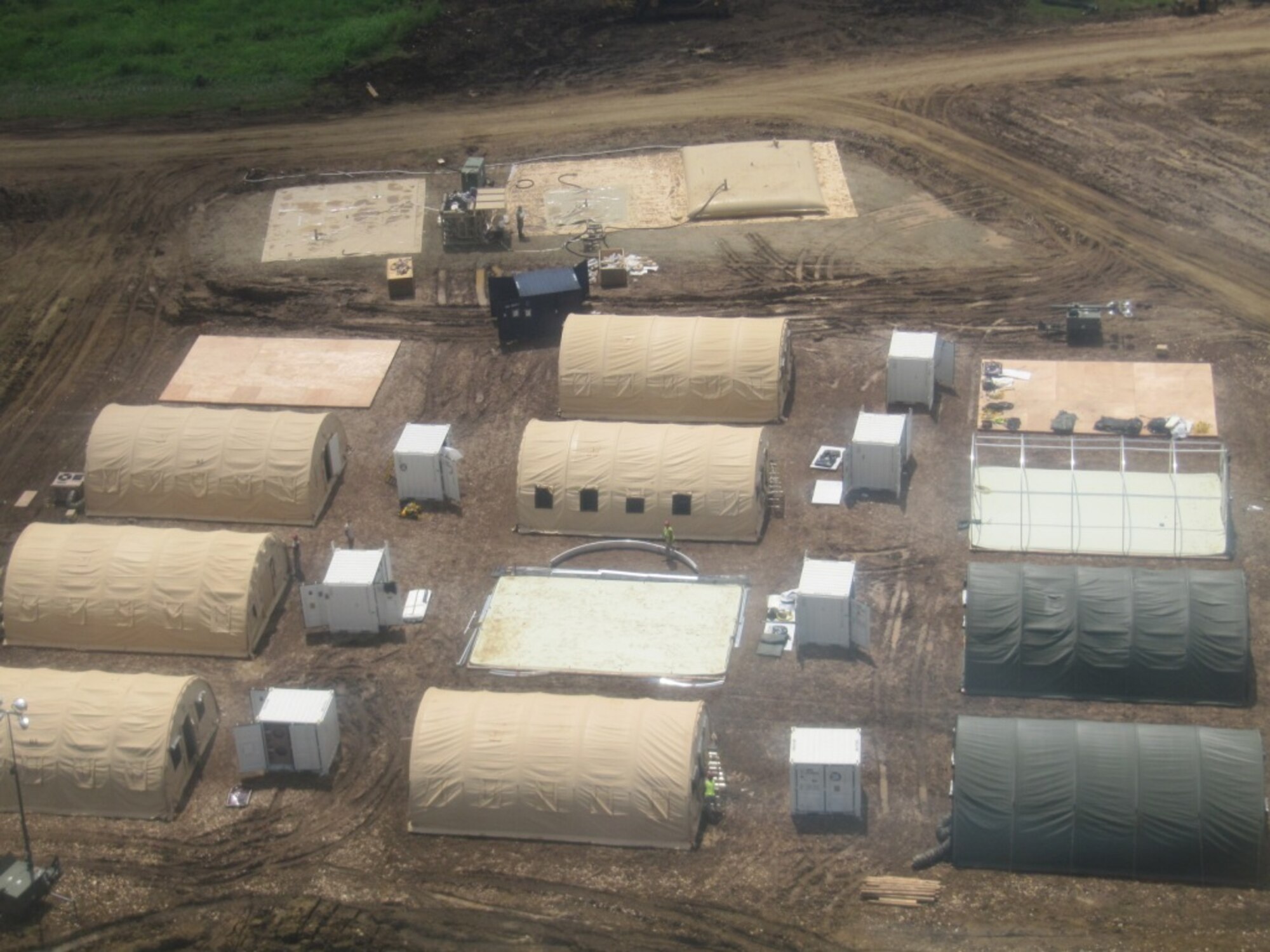 The first of the tents are erected at the temporary encampment that will house more than 250 Airmen, Soldiers, and Marines for New Horizons Panama 2010.  (U.S. Air Force photo/Senior Airman Emily Buckner)