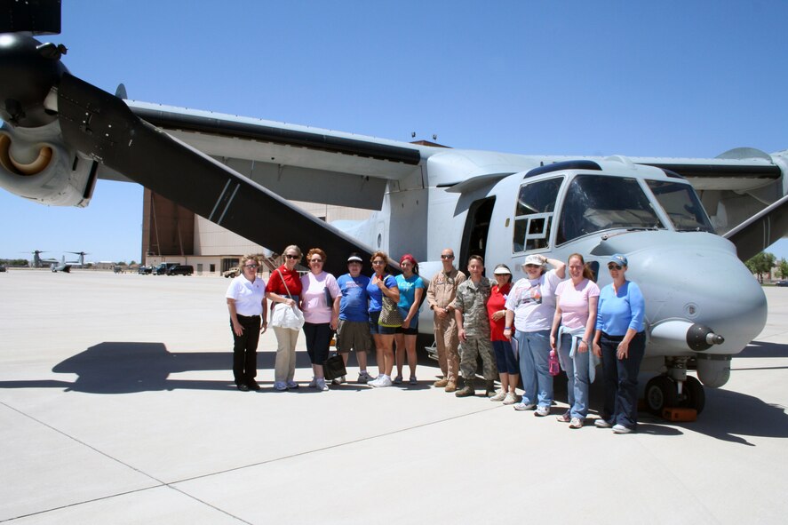 Members of the local Blue Star Mothers chapter pose in front of a CV-22 while visiting the 58th Special Operations Wing recently. Photo by Penny Huston