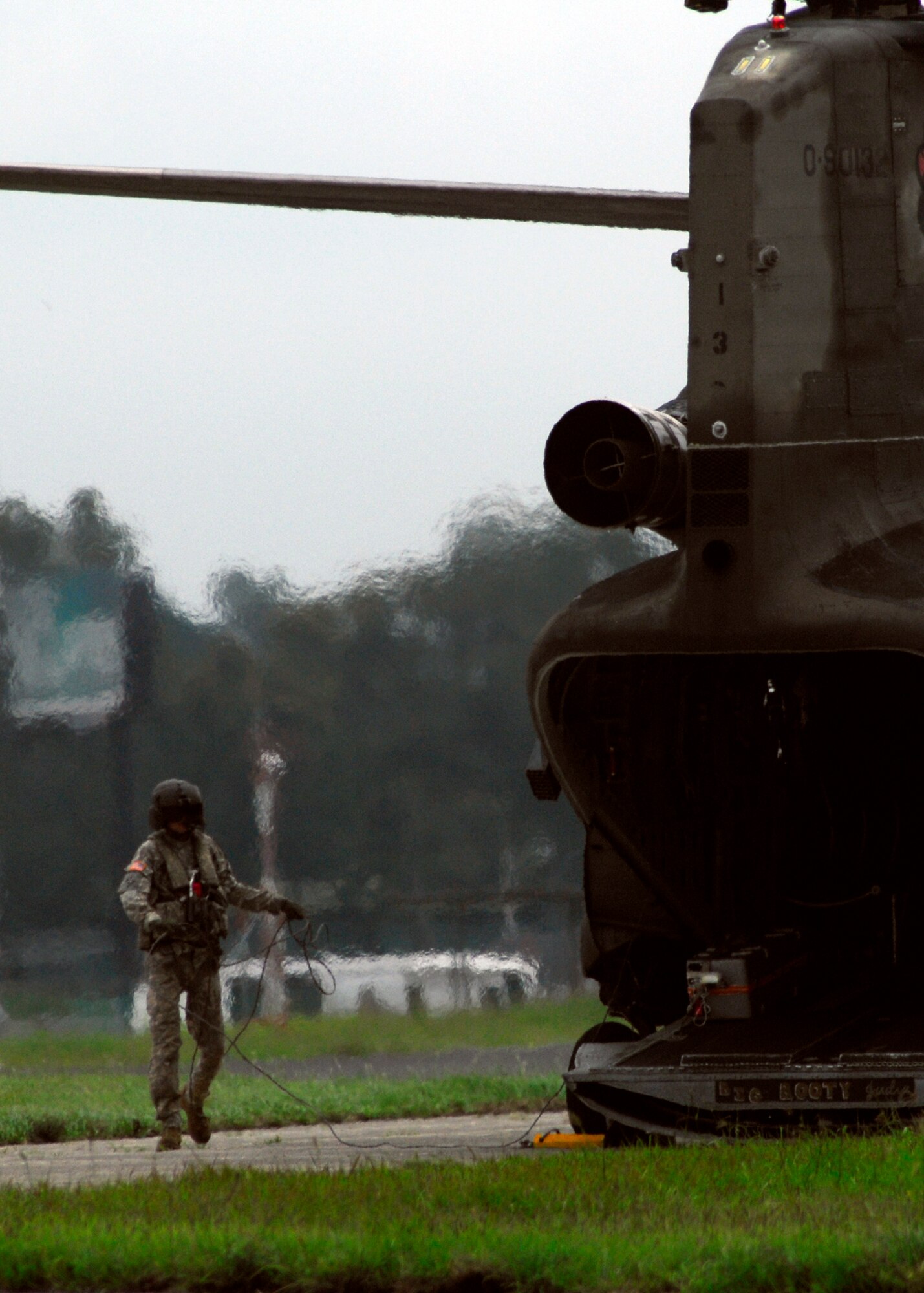 An Army 1st Battalion, 228th Aviation Regiment, aircrew member from Joint Task Force-Bravo prepares to take off June 4, 2010, to deliver food and water to communities affected by Tropical Storm Agatha and the Pacaya volcano. Joint Task Force-Bravo's helicopters and personnel transported nearly 53,000 pounds of relief supplies June 3 through 4 to Guatemalan communities in need. (U.S. Air Force photo/Staff Sgt. Bryan Franks) 
