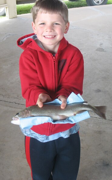 Jackson Sauls prodly displays the trout he caught during National Kid's Fishing Day June 5 at Pow Wow Park. The Department of Fish, Wildlife and Parks stocked the pond with more than 650 trout between May 12 and 27. (Courtesy photo)