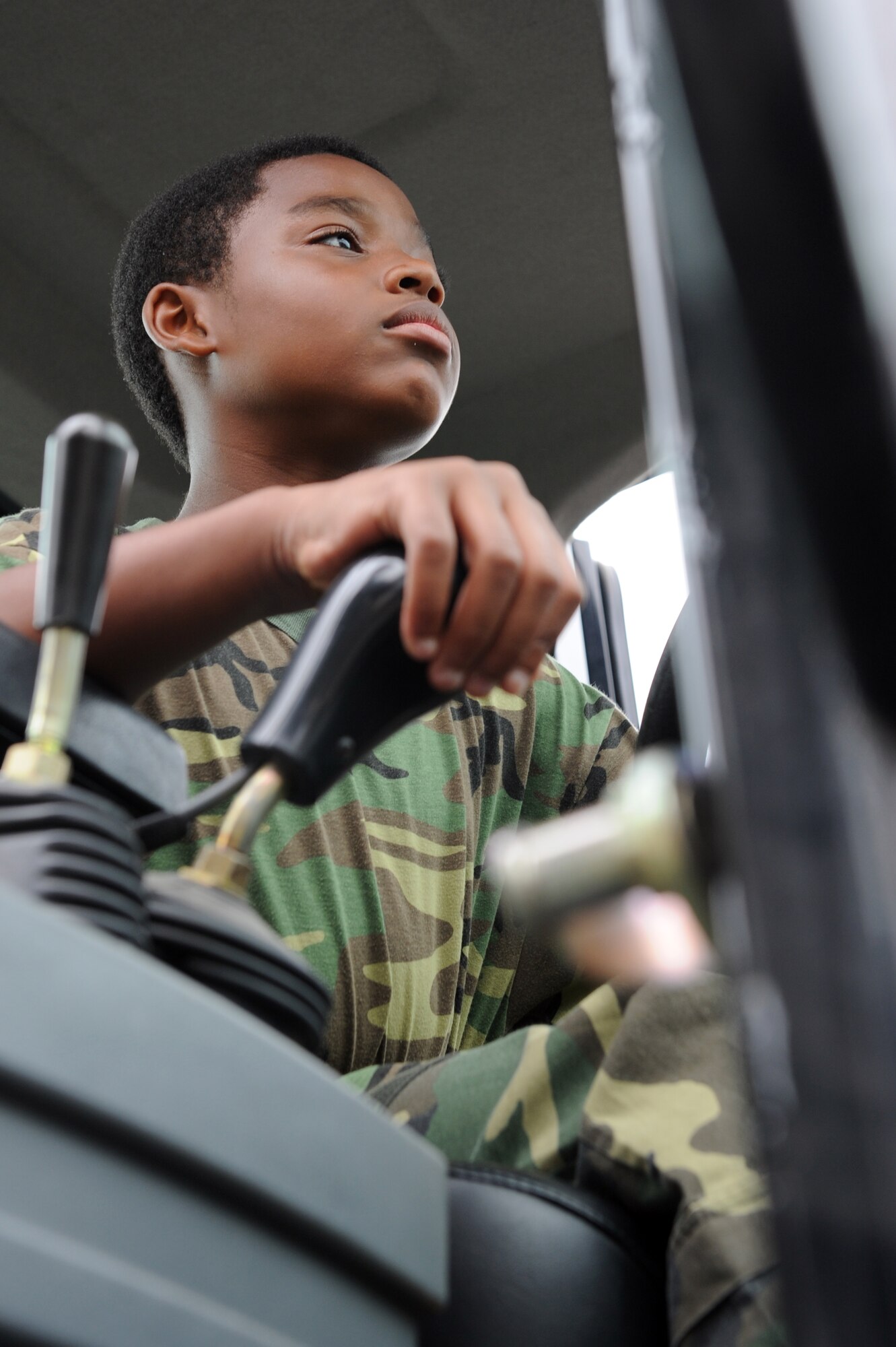 JOINT BASE MCGUIRE-DIX-LAKEHURST, N.J. -- Brandon Reid, sixth-grade student at Jonas Salk Middle School starts the engine of a 10K all-terrain forklift during a tour here June 9.  The 621st Contingency Response Wing's 818th Global Mobility Squadron invited 16 special education students from Jonas Salk Middle School in Old Bridge, N.J. to visit the base for a tour of aircraft, facilities and equipment. (U.S. Air Force photo by Tech. Sgt. Laura K. Deckman)(released)