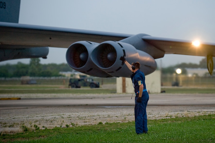 BARKSDALE AIR FORCE BASE, La. ? Senior Airman Jason Edwards, a crew chief with the 2d Aircraft Maintenance Squadron, salutes a B-52 Stratofortress as it taxis to the runway during a nuclear operational readiness exercise here June 10. The exercise is being held to prepare Barksdale Airmen for the upcoming nuclear operational readiness inspection. (U.S. Air Force photo/Senior Airman Chad Warren)