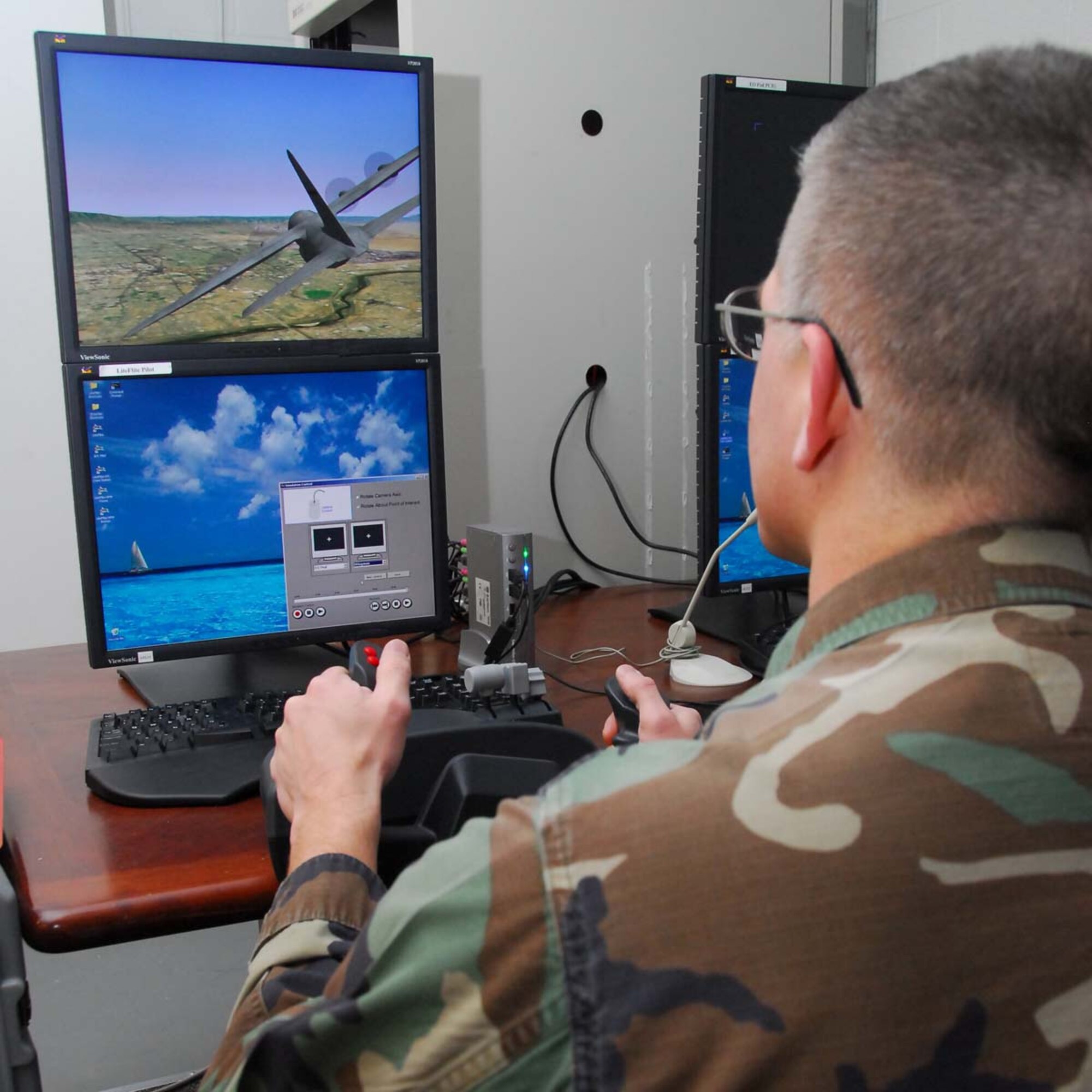 Capt. Jason Webb, section chief of the High Power Microwave division with the Air Force Research Laboratory’s Directed Energy Directorate, observes war games on his computer.  Courtesy Photo