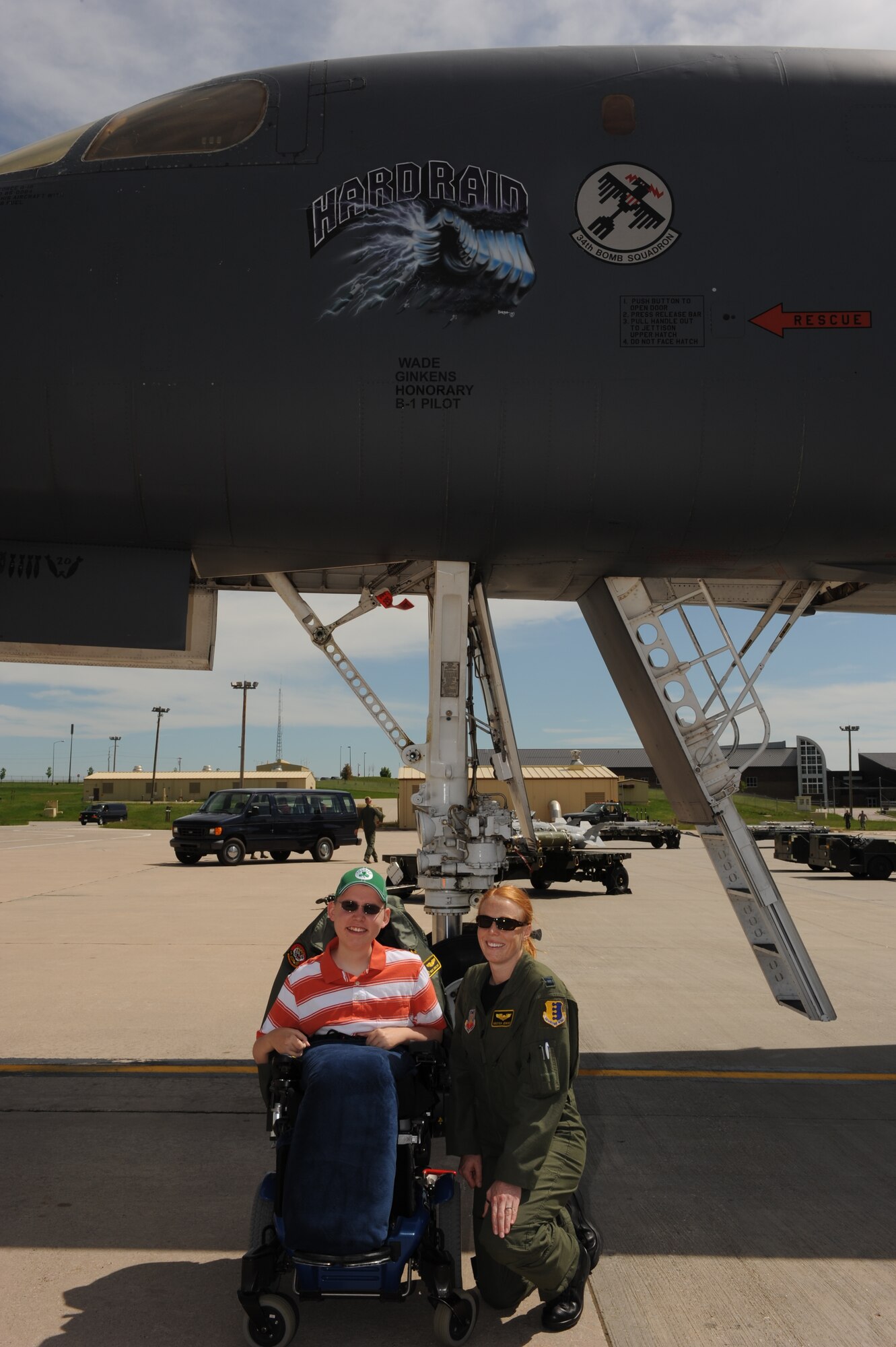 ELLSWORTH AIR FORCE BASE, S.D.-- Wade Ginkens poses with Captain Kristen "Flare" Jenkins, B-1B Lancer pilot and "Aircrew for a Day"  project coordinator, during his visit here June 10. Wade participated in the program which gives children  a chance to forget about their illness for a day and enjoy being a kid. (U.S. Air Force photo/Master Sgt. Loren J. Bonser)

