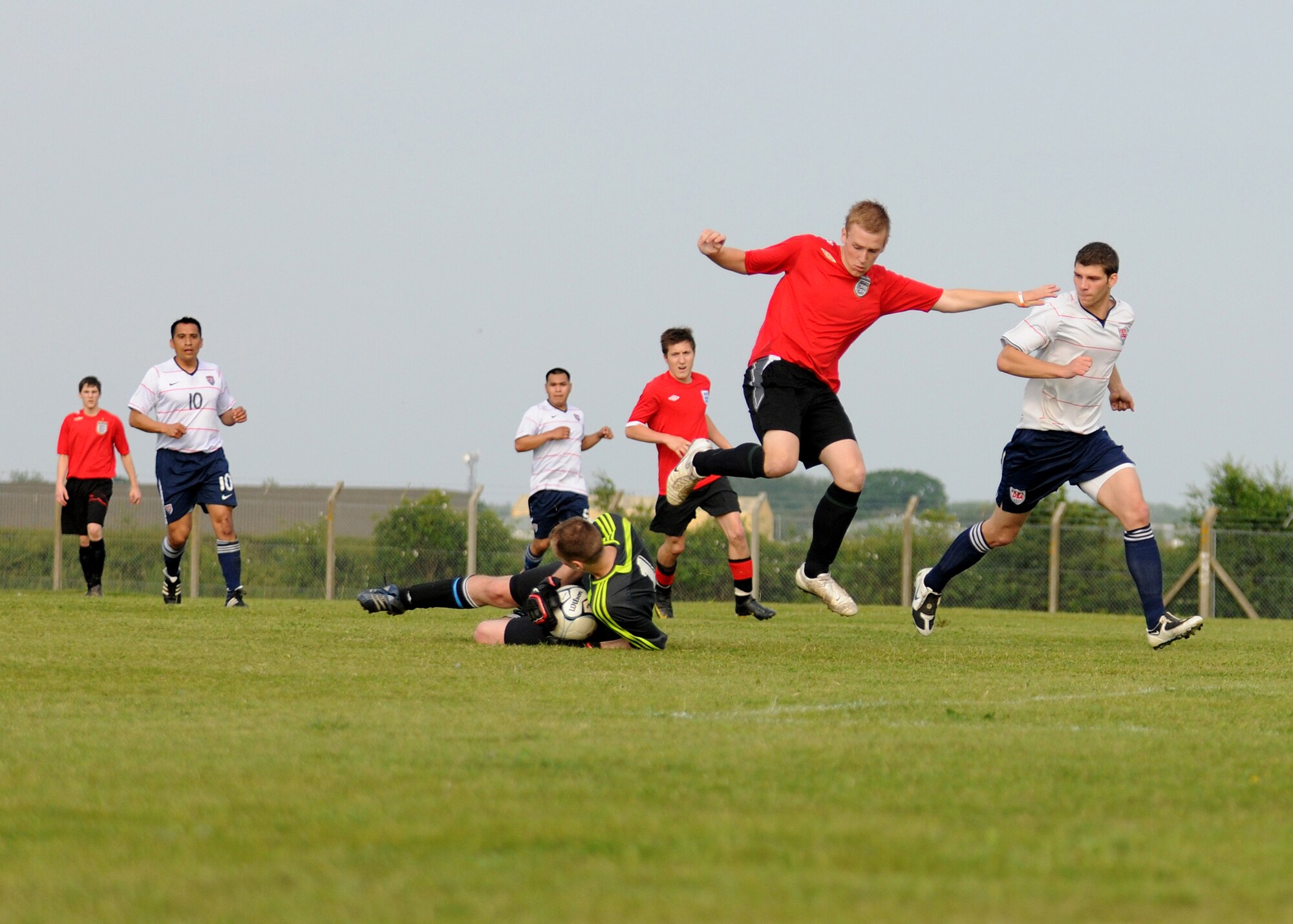 The USA goalie snatches the ball from an English player on RAF Mildenhall in the base’s exhibition soccer match, dubbed the World Cup kick off, June 11.  With a final score of 4-1, the match was set up to mimic the upcoming USA vs. England soccer match in the World Cup June 12.  For more coverage on the base’s game, check www.mildenhall.af.mil on June 14.