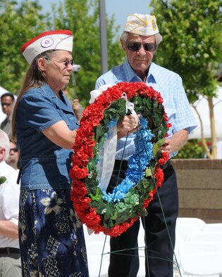 Members of the United Veterans Council of New Mexico place a memorial wreath during the ceremony May 31.  Air Force Photo by Dennis Carlson