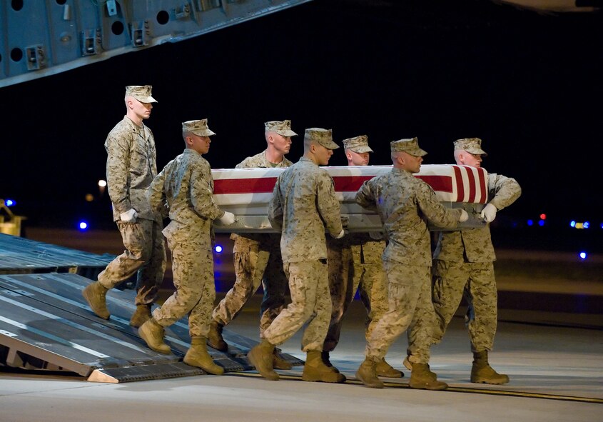 29 April 2010  USAF Photo by Jason Minto.  A U.S. Marine Corps carry team transfers the remains of Marine LCPL Thomas E. Rivers Jr., of Birmingham, AL., at Dover Air Force Base, Del., April 29, 2010.