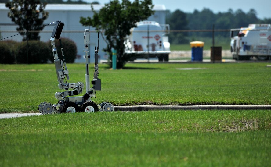 MOODY AIR FORCE BASE, Ga. -- An F6-A Explosive Ordnance Disposal robot moves in to disarm ordnance during a multi-agency exercise at the Valdosta Airport, Valdosta, Ga.  June 9. The F6-A is a remote controlled camera operated unit used to keep Airmen out of harms-way while disarming ordnance making it a very useful tool in their arsenal. (U.S. Air Force photo by Airman 1st Class Joshua Green/RELEASED)  