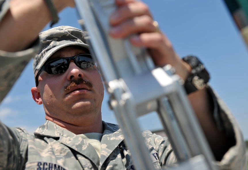 MOODY AIR FORCE BASE, Ga. -- Tech. Sgt. Richard Schmidt, 23rd Civil Engineering Squadron explosive ordnance disposal craftsman, preps a F6-A EOD robot during a multi-agency exercise at the Valdosta Airport, Valdosta, Ga.  June 9. The F6-A is a remote controlled camera operated unit used to go into the area where the explosive ordnance is located, which allows EOD Airmen to diffuse the EO from a safe distance. (U.S. Air Force photo by Airman 1st Class Joshua Green/RELEASED)