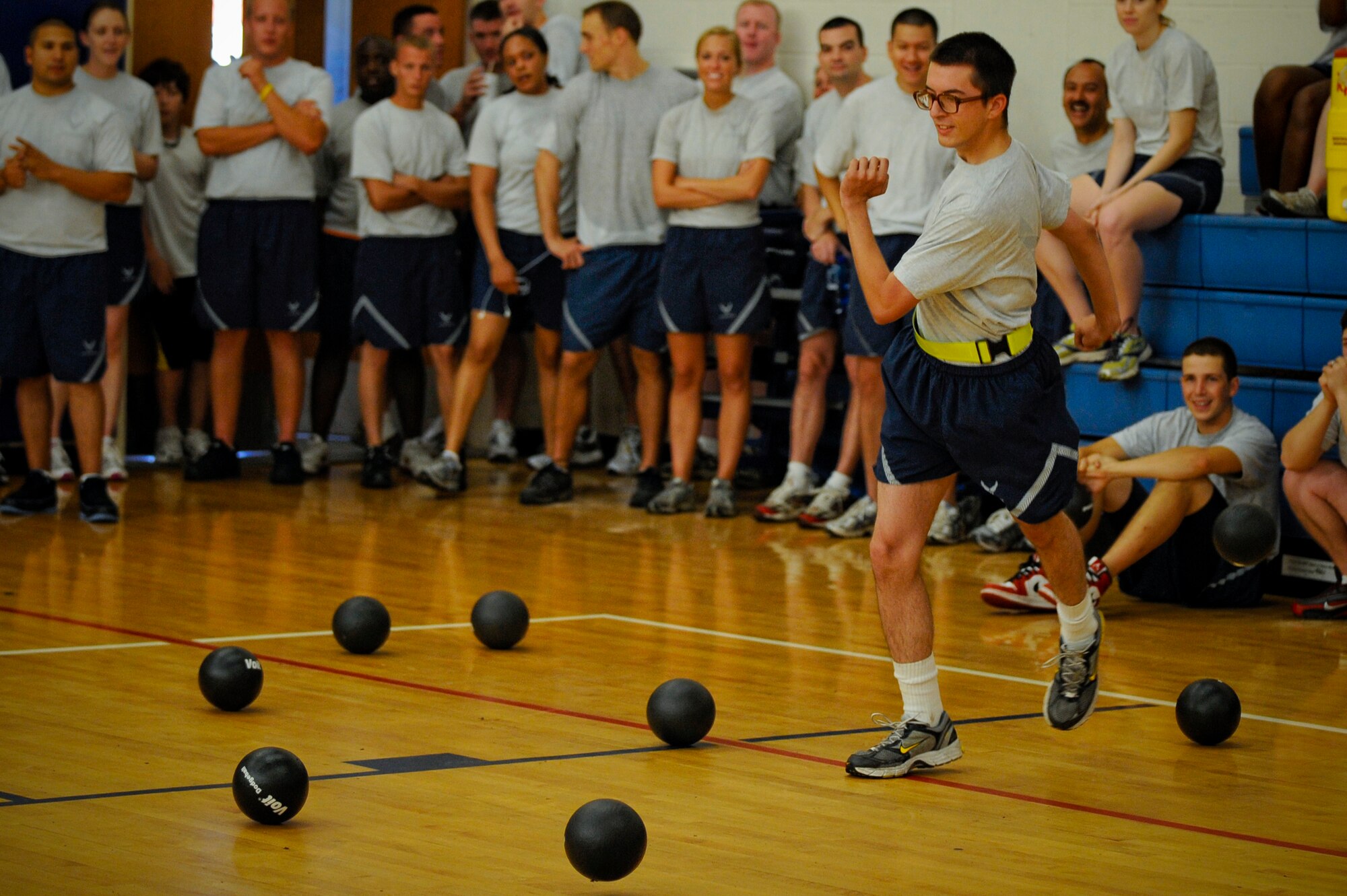 Airman 1st Class James Rodrick, 6th Operations Group, dodges a ball during a game of dodgeball at the 6th Air Mobility Wing Sports Day at MacDill Air Force Base, Fla., Jun. 11, 2010.  Members from the 6 AMW participated in a number of different sporting events during Sports Day to promote fun and camaraderie.  (U.S. Air Force photo by Staff Sgt. Joseph L. Swafford Jr./Released)