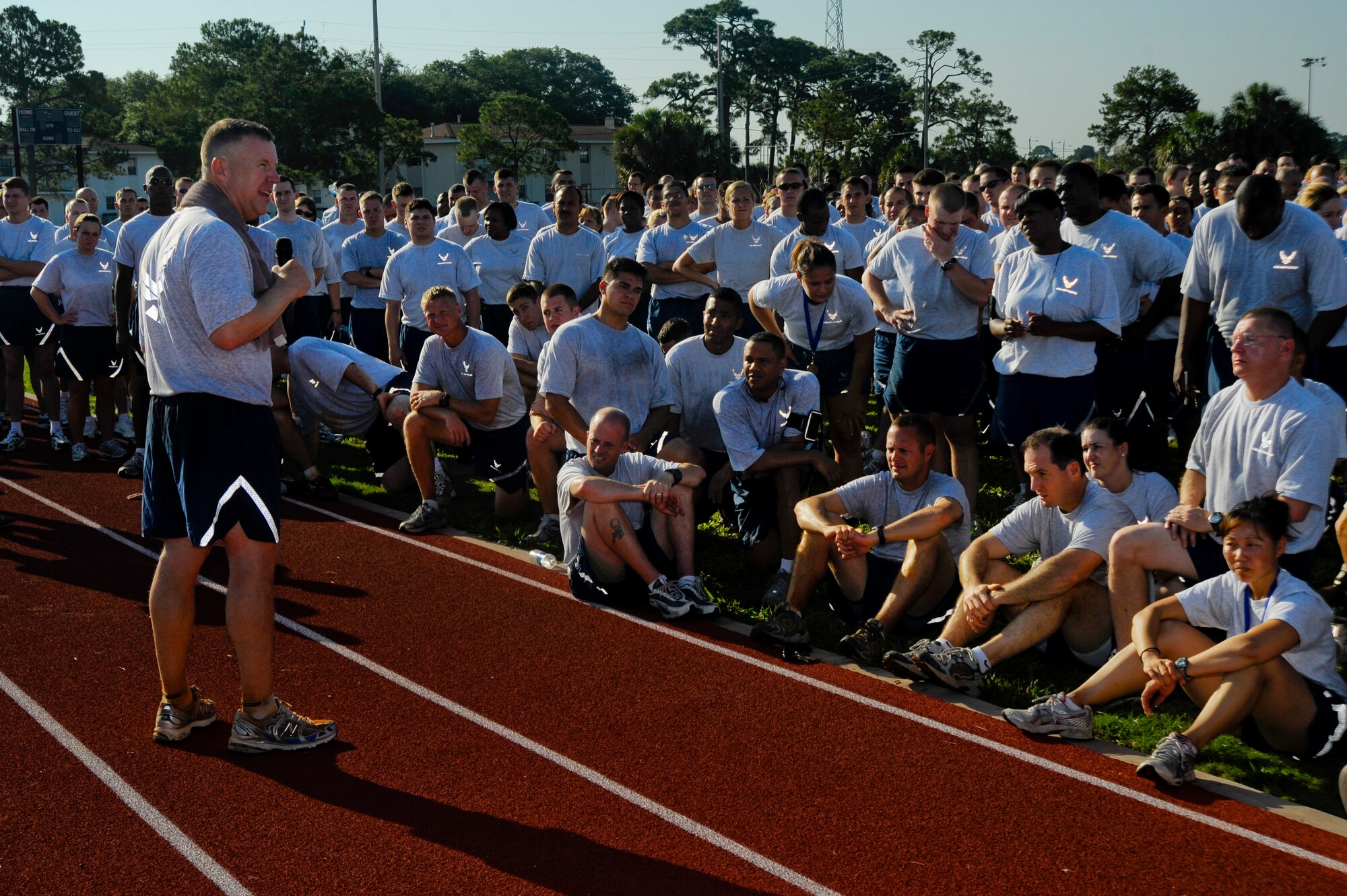 Col. Larry Martin, 6th Air Mobility Wing commander, gives a speech as Airmen of the 6th AMW look on after Sports Day at MacDill Air Force Base, Fla., Jun. 11, 2010.  Members from the 6 AMW participated in a number of different sporting events during Sports Day to promote fun and camaraderie.  (U.S. Air Force photo by Staff Sgt. Joseph L. Swafford Jr./Released)