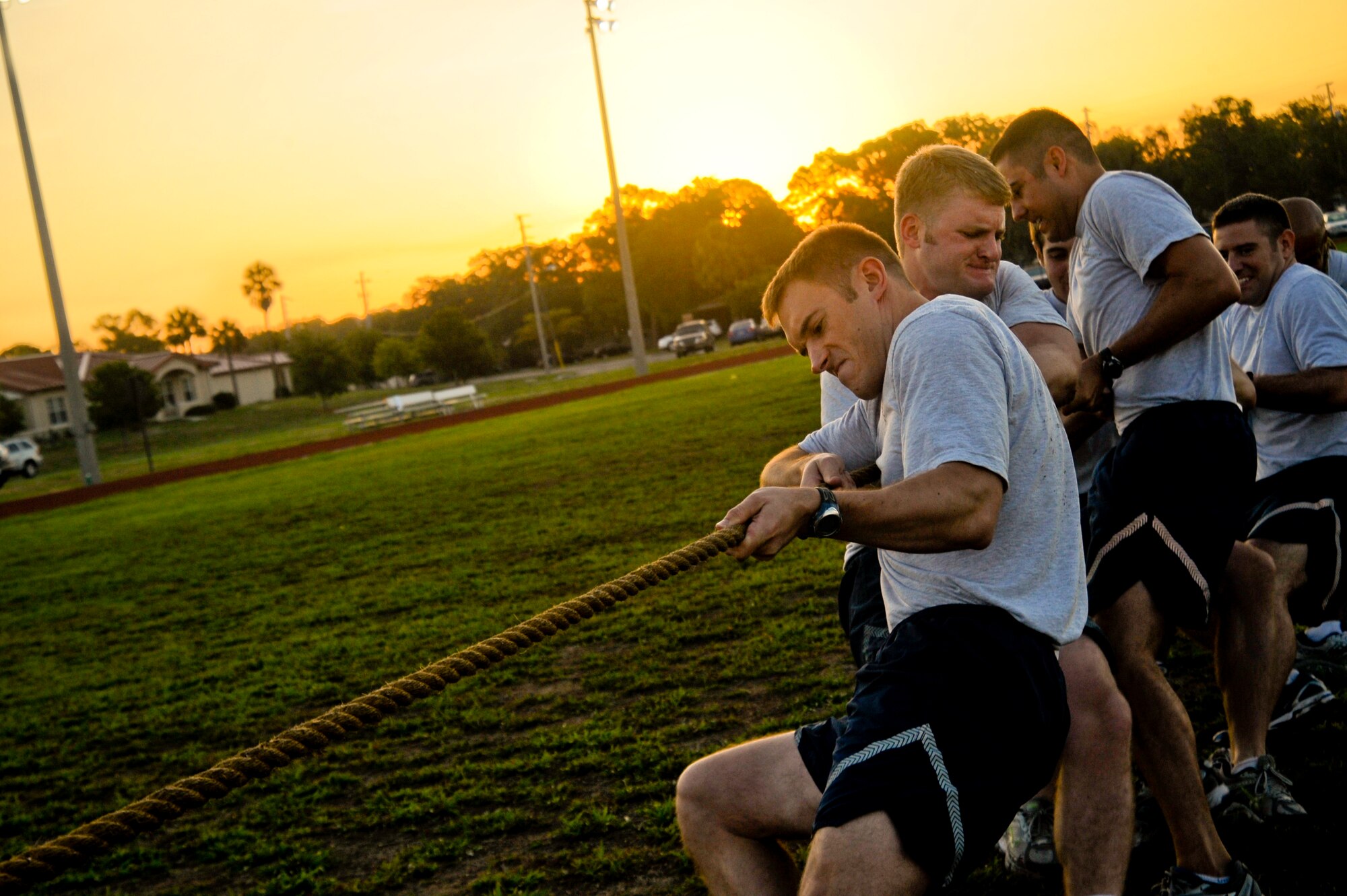 Members of the 6th Operations Group participate in a game of tug of war during the 6th Air Mobility Wing Sports Day at MacDill Air Force Base, Fla., Jun. 11, 2010.  Members from the 6 AMW participated in a number of different sporting events during Sports Day to promote fun and camaraderie.  (U.S. Air Force photo by Staff Sgt. Joseph L. Swafford Jr./Released)