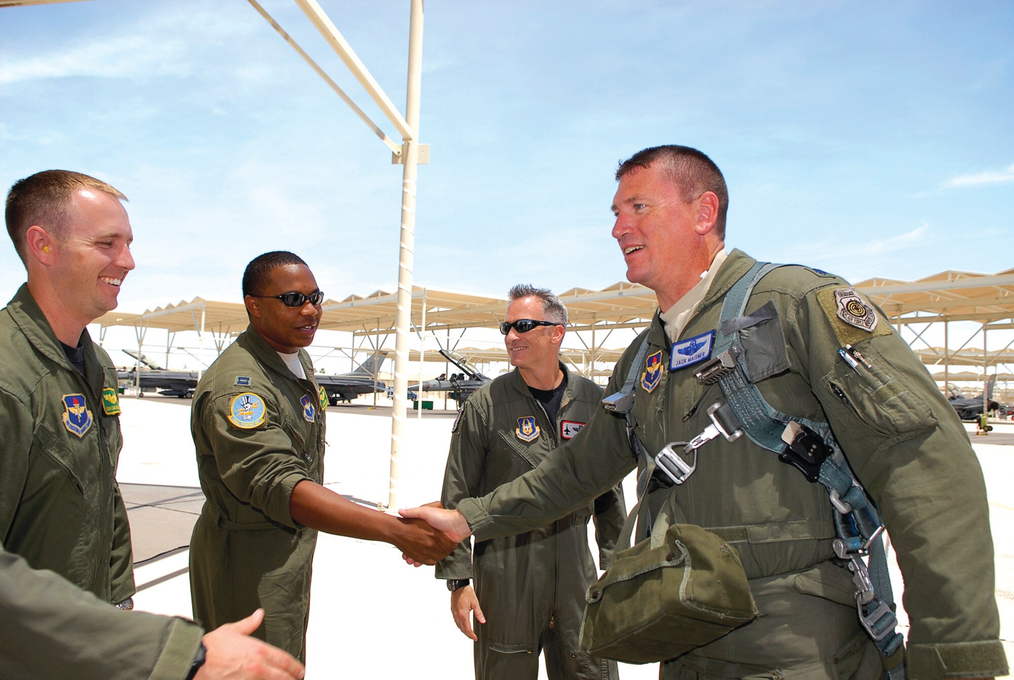 Lt. Col. Jack Maixner, 56th Operations Group deputy commander, greets fellow 310th Fighter Squadron pilots after landing June 3. During his flight, Colonel Maixner surpassed 3,000 flying hours in the F-16 Fighting Falcon. (Photo by Airman 1st Class Ronifel Yasay)