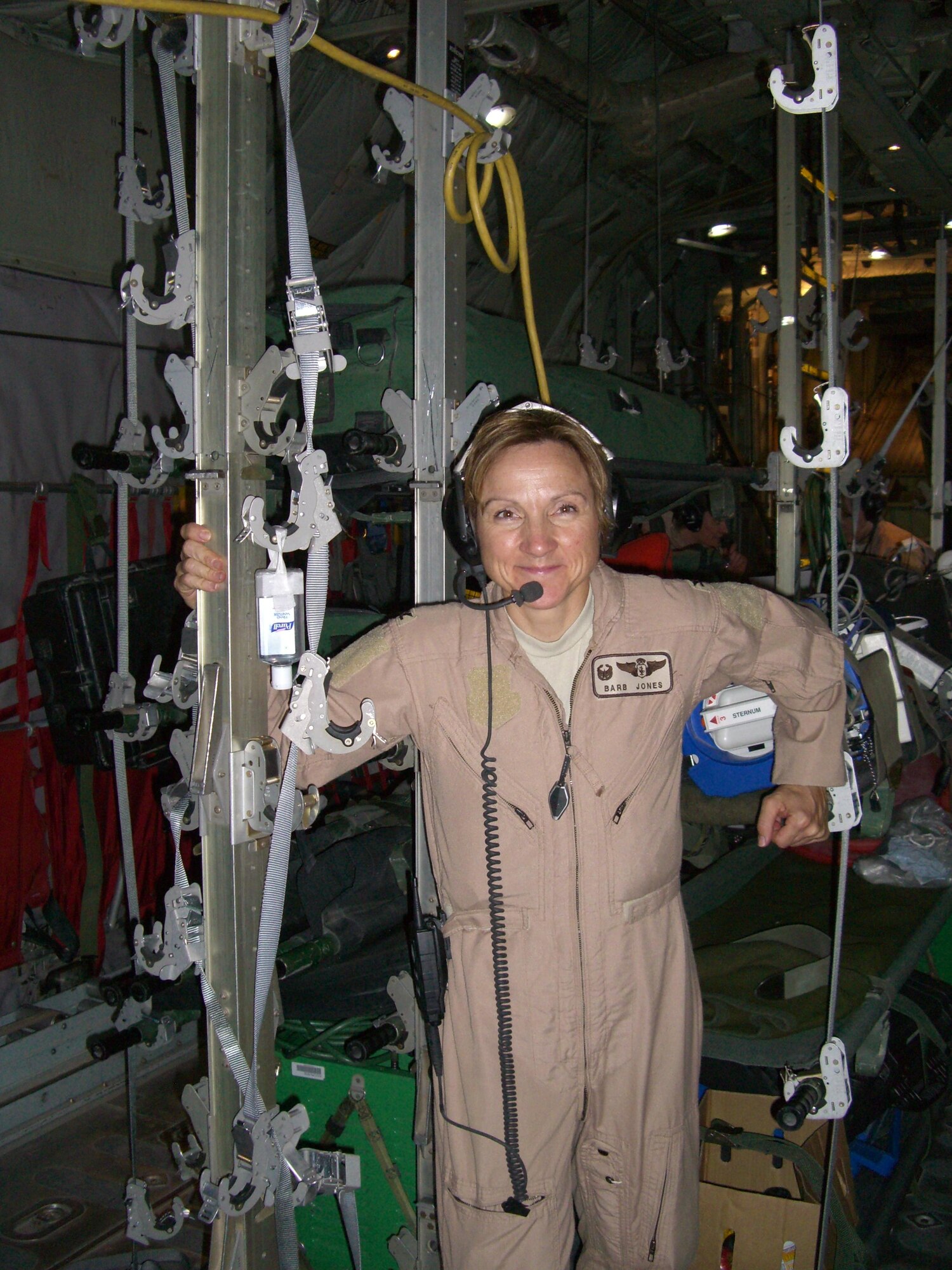 Col. Barbara Jones stands in an aircraft while deployed to Southwest Asia recently. Colonel Jones was commander for the 379th Expeditionary Aeromedical Evacuation Squadron, where she was responsible for ensuring execution of the EAES air tasking orders in support of Operations Iraqi and Enduring Freedom.  (U.S. Air Force Photo courtesy)
