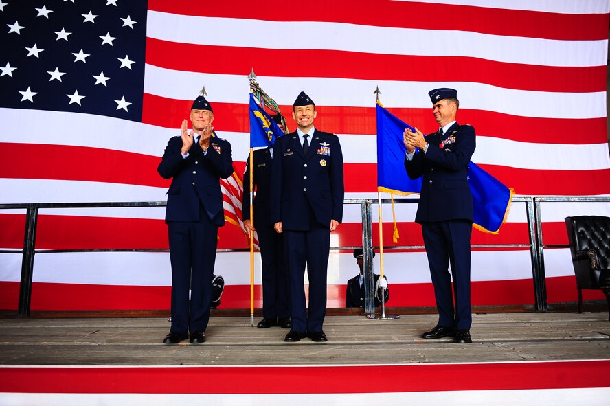 DYESS AIR FORCE BASE, Texas – Colonel Gerald Goodfellow takes command of the 7th Operations Group during a change of command ceremony here, June 11.  Col. Goodfellow received his commission through the University of New Mexico’s Reserves Officer Training Corps program in 1989. He’s a Master Navigator with more than 2,800 flight-hours and has flown the B-1 and KC-135. Also pictured, Col. Charles Catoe (left) who relinquished command of the 7th Operations Group and Col. Robert Gass, (right) 7th Bomb Wing commander. (U.S. Air Force photo/ Senior Airman Stephen Reyes)