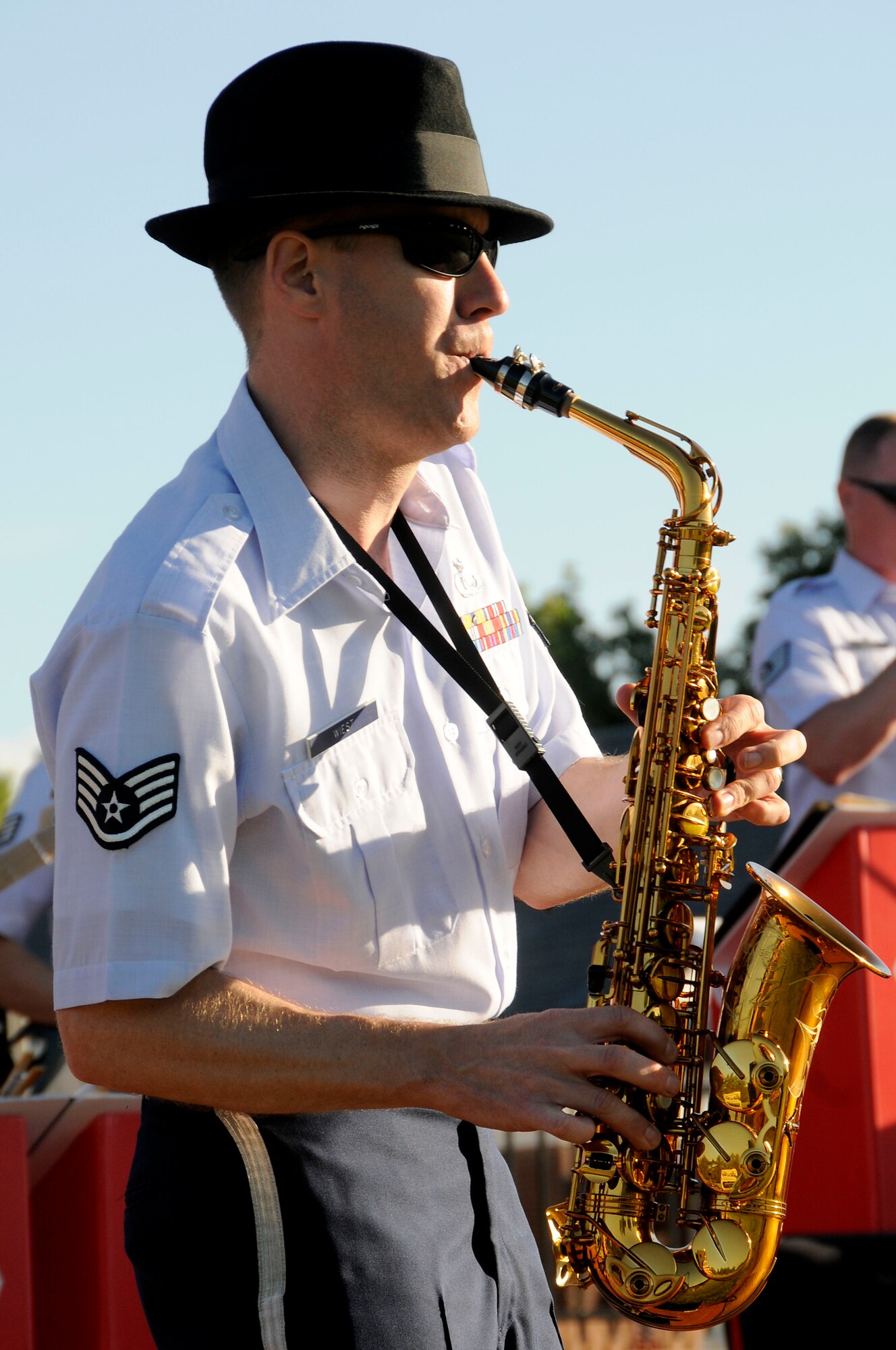 Staff Sgt. Dwight Wiest jams out on his saxophone during the United States Air Force Band of Mid-America's concert at Scott AFB parade field, June 6, 2010. The Shades of Blue Jazz Ensemble performed in front of Team Scott to kick off the summer concert series. Upcoming performances in the summer concert series include Starlifter, Aug. 1, and the concert band Aug. 29. (U.S. Air Force photo by Staff Sgt. Brian J. Ellis)