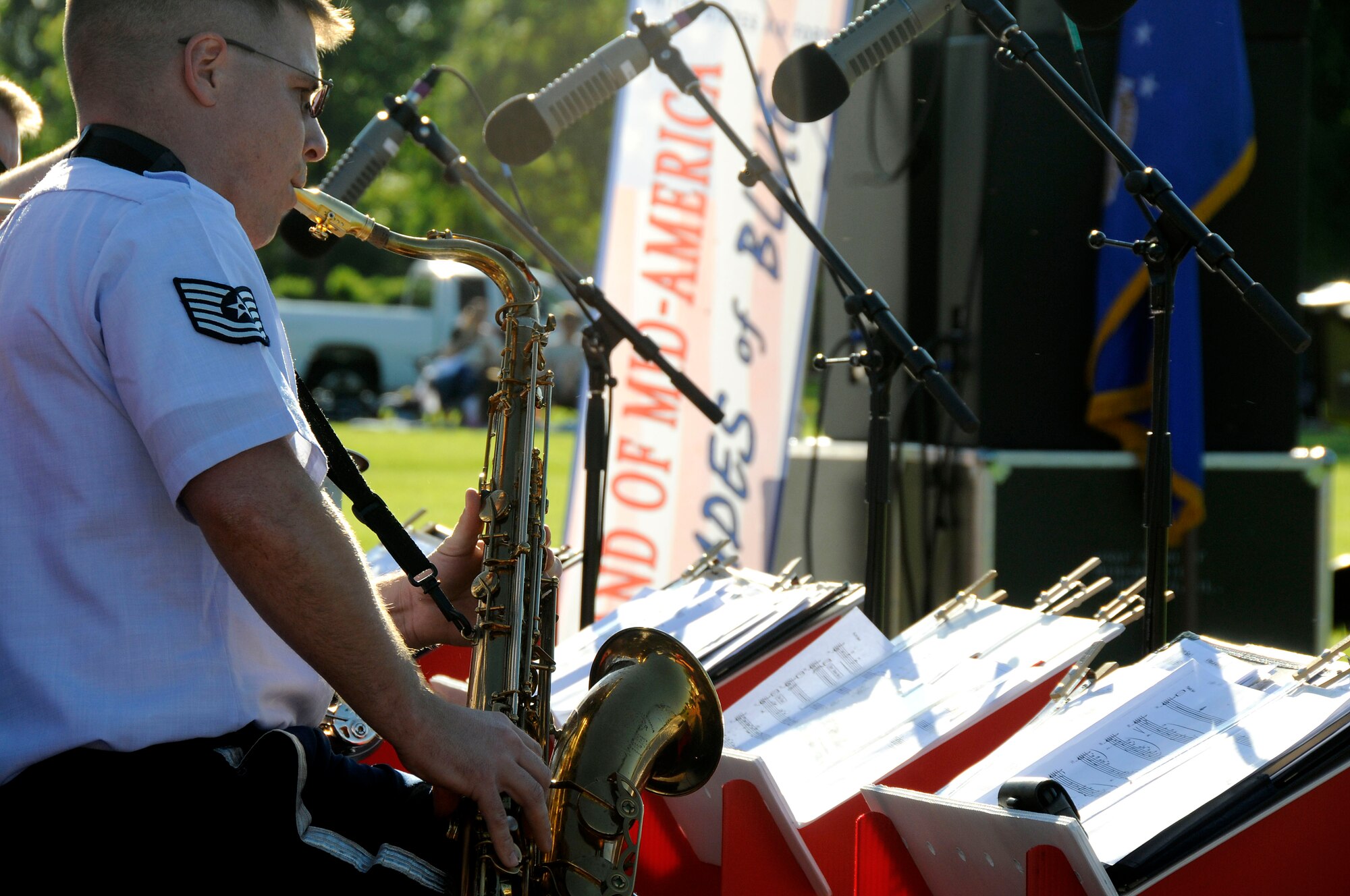 Tech. Sgt. Jason Baedke plays his saxophone during the United States Air Force Band of Mid-America's concert at Scott AFB parade field, June 6, 2010. The Shades of Blue Jazz Ensemble performed in front of Team Scott to kick off the summer concert series. Upcoming performances in the summer concert series include Starlifter, Aug. 1, and the concert band Aug. 29. (U.S. Air Force photo by Staff Sgt. Brian J. Ellis)