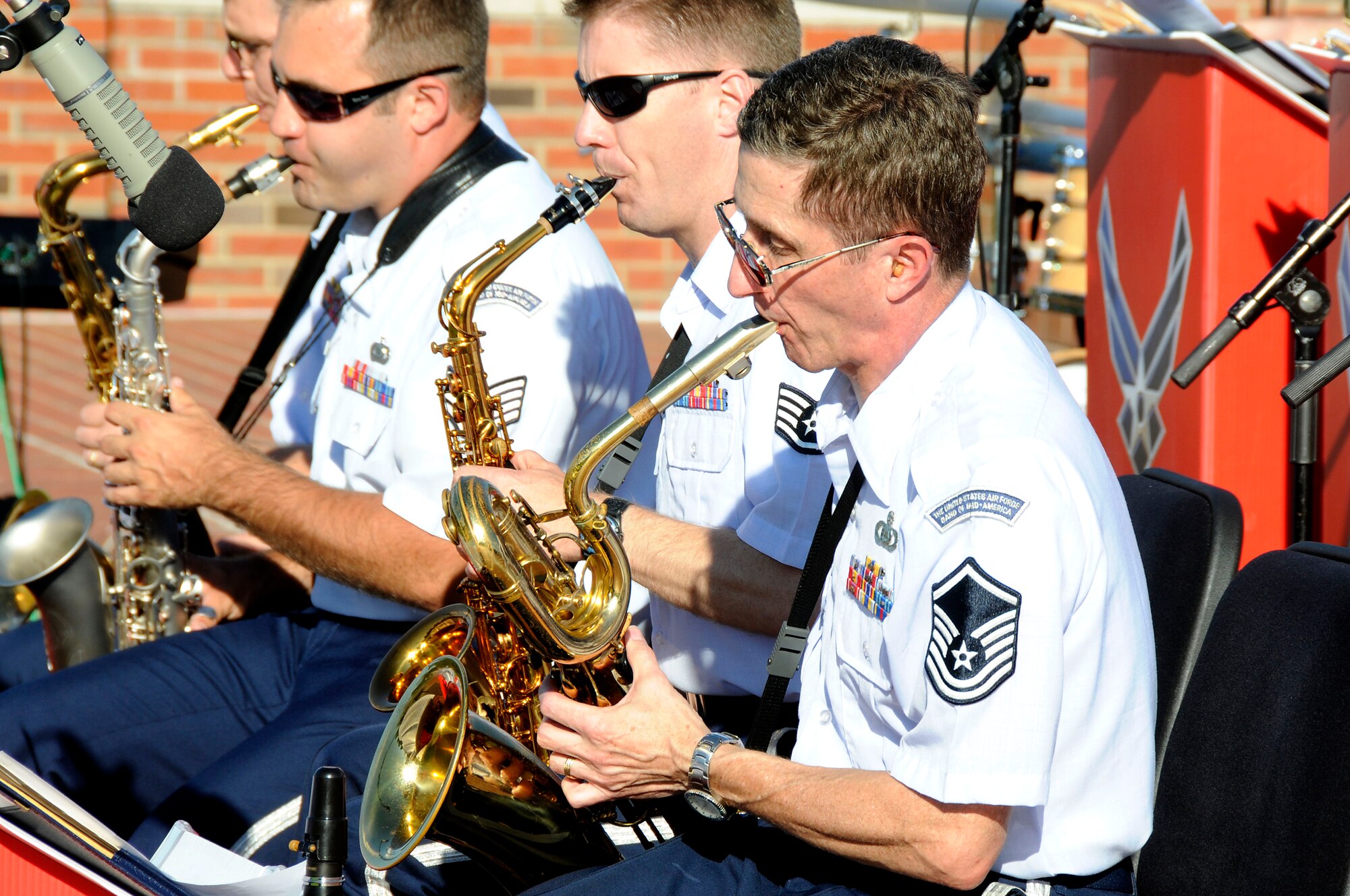 Master Sgt. Michael Witte plays his saxophone during the United States Air Force Band of Mid-America's concert at Scott AFB parade field, June 6, 2010. The Shades of Blue Jazz Ensemble performed in front of Team Scott to kick off the summer concert series. Upcoming performances in the summer concert series include Starlifter, Aug. 1, and the concert band Aug. 29. (U.S. Air Force photo by Staff Sgt. Brian J. Ellis)