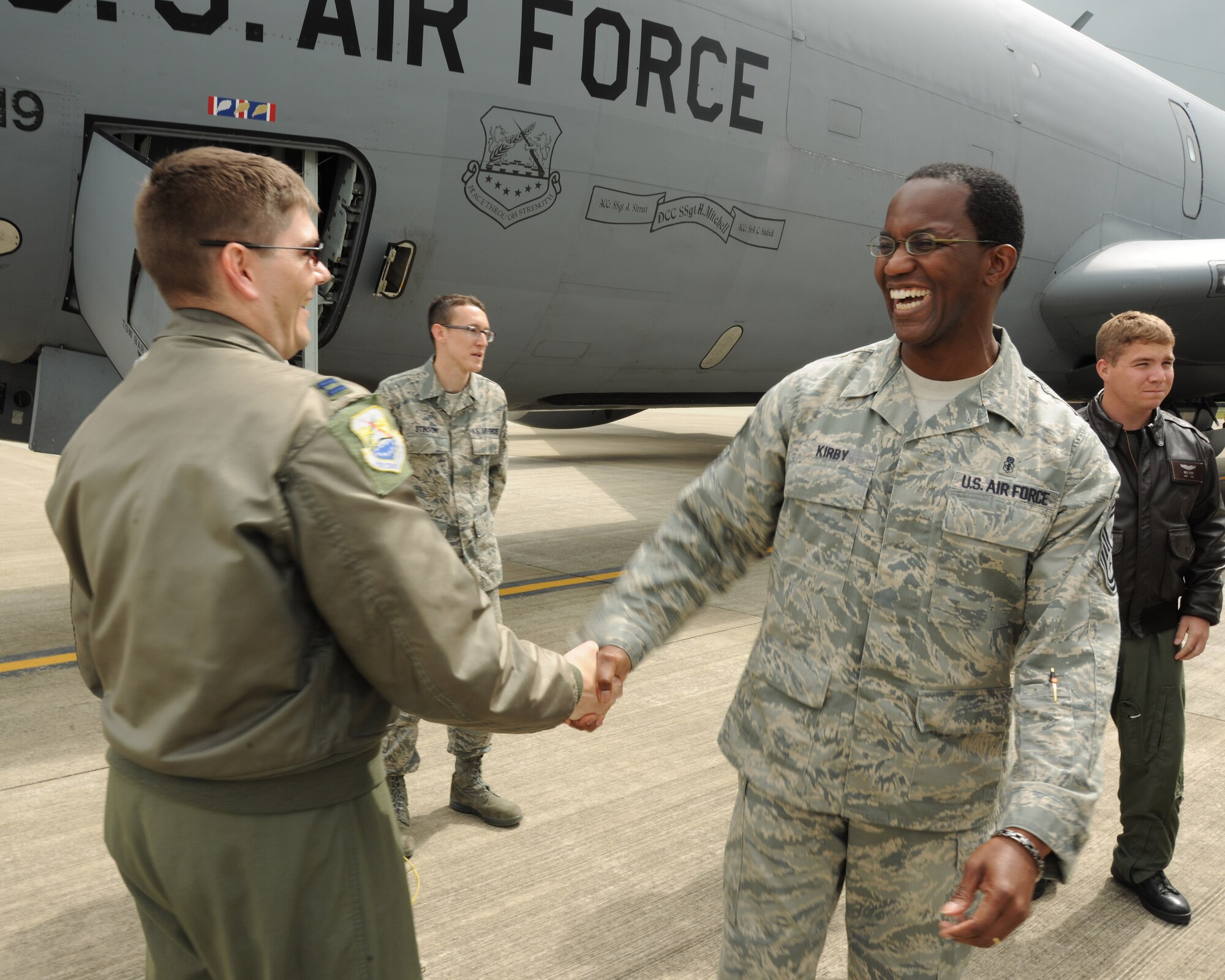 RAF FAIRFORD, United Kingdom - (Right) 501st Command Chief Master Sgt. Larence Kirby meets with aircrew from the 100th Air Refueling Wing during the Royal International Air Tattoo Media Day Launch June 9. The media launch promoted the world's largest airshow, RIAT, July 17 and 18. (U.S. Air Force photo by Staff Sgt. Joel Mease)