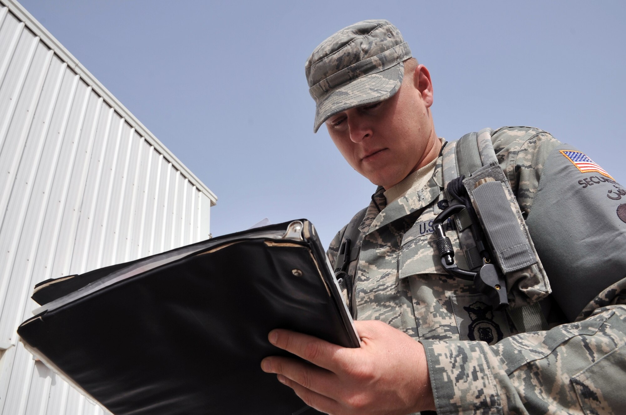 Staff Sgt. Tommy Dailey, security forces craftsman deployed with the 380th Expeditionary Security Forces Squadron, works on a report during operations for the 380th Air Expeditionary Wing at a non-disclosed base in Southwest Asia on June 11, 2010. Sergeant Dailey is deployed from the 4th Security Forces Squadron at Seymour-Johnson Air Force Base, N.C., and his hometown is Carbondale, Ill. (U.S. Air Force Photo/Master Sgt. Scott T. Sturkol/Released)