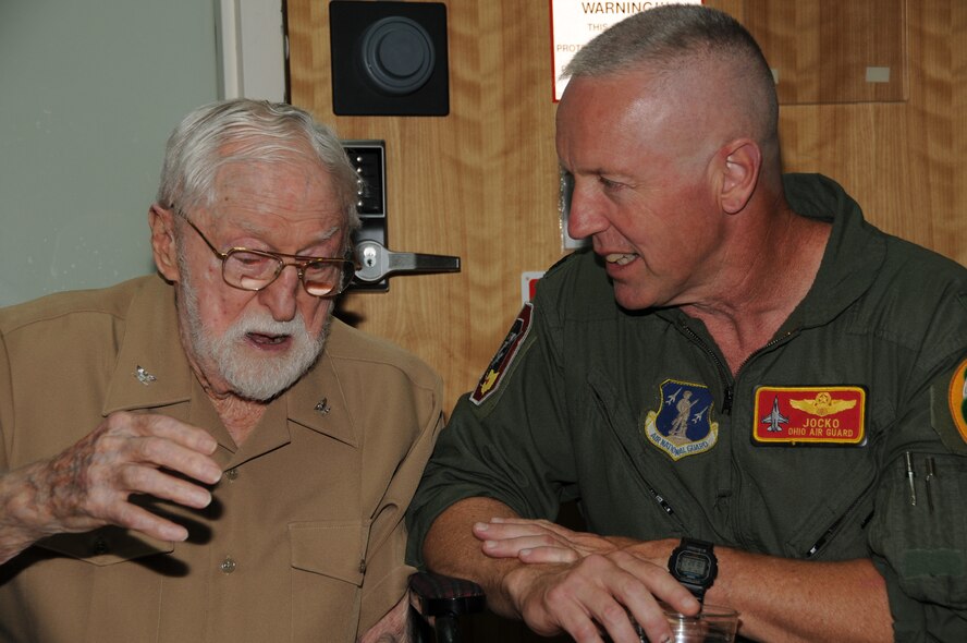 The first 16nd Fighter Squadron commander, Col. Rodney Boren, shares with current and last 162 FS commander, Col. John Thompson at the F-16 hail and Farewell reunion June 4, 