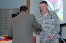 HANSCOM AIR FORCE BASE, Mass. – Col. James Lovell (right), acting commander of the 551st Electronic Systems Wing, shakes hands with people in attendance at his farewell luncheon in Building 1612’s atrium on June 8. Colonel Lovell will become the deputy director for the Global Power Programs office of the Assistant Secretary of the Air Force for Acquisition at the Pentagon. (U.S. Air Force photo by Rick Berry)