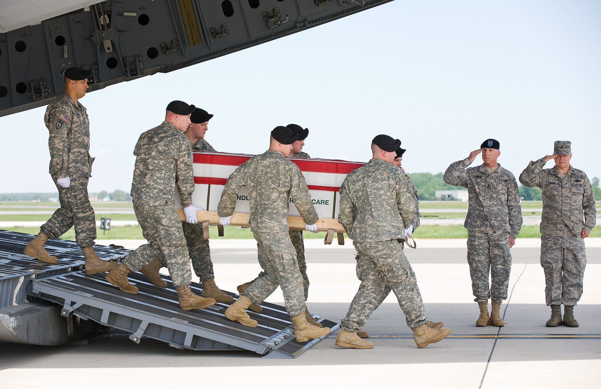 4 May 2010  USAF Photo by Jason Minto.  A U.S. Army carry team transfers the remains of Army SGT Anthony O. Magee of Hattiesburg, MS. at Dover Air Force Base, Del., May 4, 2010.