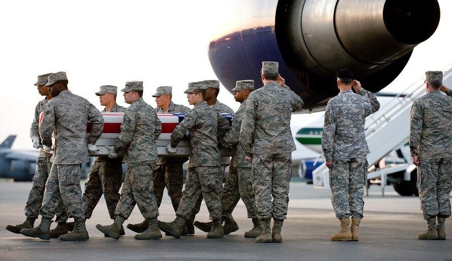4 May 2010  USAF Photo by Jason Minto.  A U.S. Air Force carry team transfers the remains of Air Force A1C Austin H. Gates Benson of Hellertown, PA, at Dover Air Force Base, Del., May 4, 2010.
