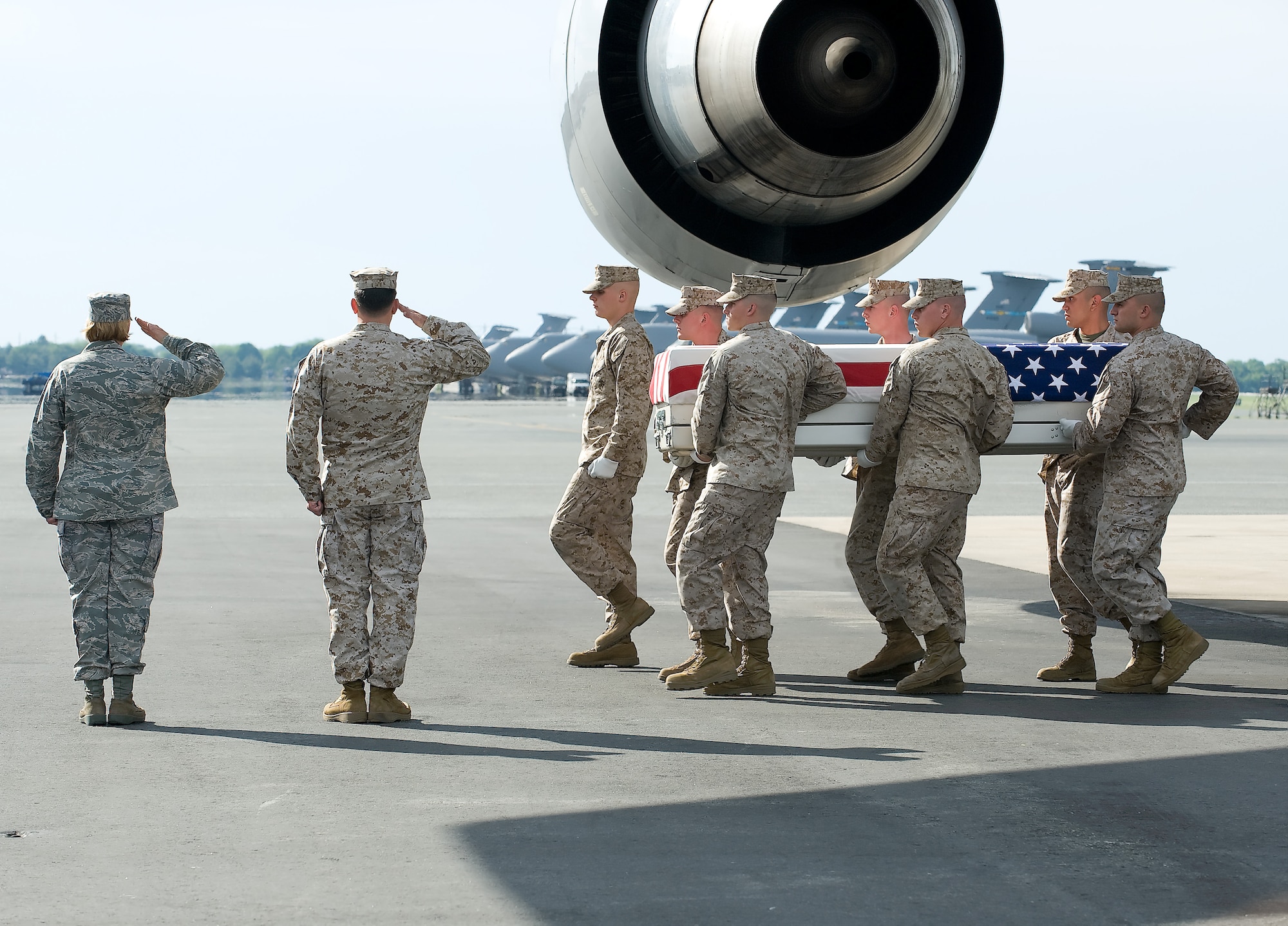 A U.S. Marine Corps team transfers the remains of Marine Corps 1 LT Brandon Barrett of Monon, I.N., at Dover Air Force Base, Del., on May 7, 2010.  (U.S. Air Force photo/Brianne Zimny)