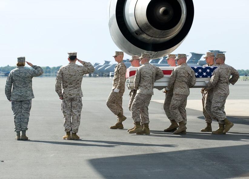 A U.S. Marine Corps team transfers the remains of Marine Corps Capt. Brandon Barrett of Monon, Ind., at Dover Air Force Base, Del., May 7, 2010. (U.S. Air Force photo/Brianne Zimny)  