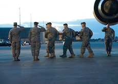 A U.S. Army carry team transfers the remains of Army Spc. Wade A. Slack of Waterville, Maine, at Dover Air Force Base, Del., May 8, 2010. (U.S. Air Force photo/Brianne Zimny) 